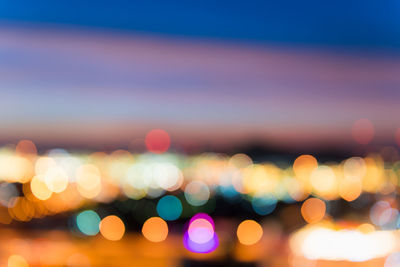 Defocused image of illuminated lights at night