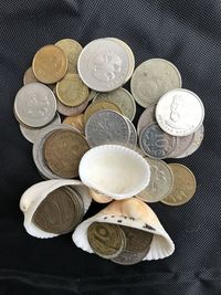 High angle view of coins on table