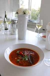 Close-up of gravy served in bowl on table