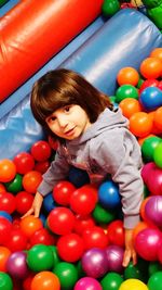 Portrait of smiling girl with multi colored balls