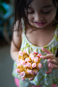 Small flower bouquet being hold by a toddler.