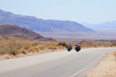 Man riding motorcycle on road