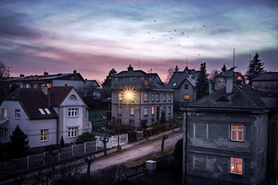 High angle view of buildings against sky at dusk