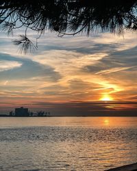 Scenic view of sea against orange sky