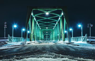 Illuminated street lights during winter at night