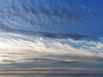 Low angle view of dramatic sky over sea