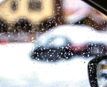 Close-up of raindrops on glass window