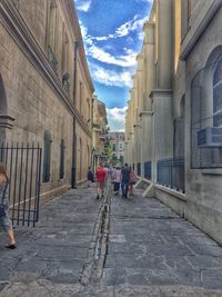 People walking on road in city