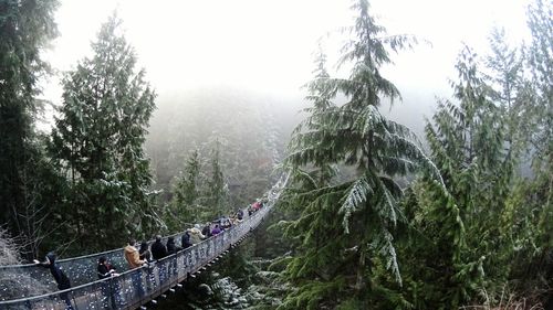 Panoramic view of people on mountain against sky