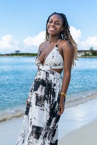 Young woman standing at beach