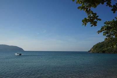 Scenic view of sea against blue sky