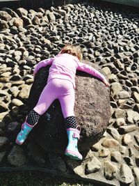 Rear view of girl on sand