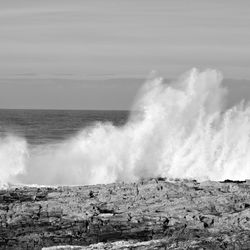 Waves breaking against sea