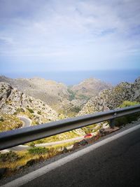 Scenic view of mountain road against sky