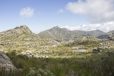 Scenic view of landscape and mountains against sky