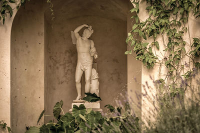 Statue against wall