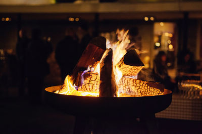 Close-up of lit candles at night