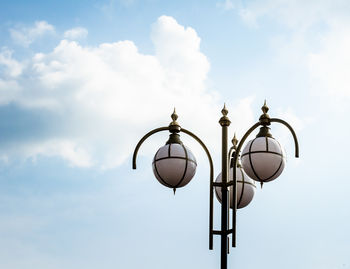 Low angle view of street light against sky