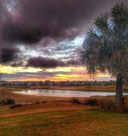 Scenic view of landscape against cloudy sky