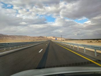 Road seen through car windshield