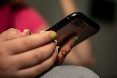 Midsection of woman using mobile phone