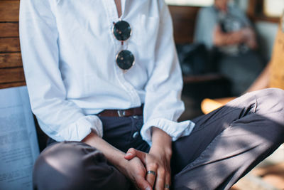 Midsection of woman traveling in train