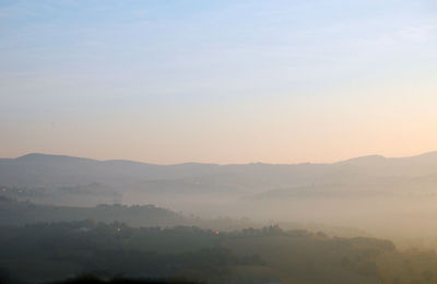 Scenic view of mountains against sky during sunset