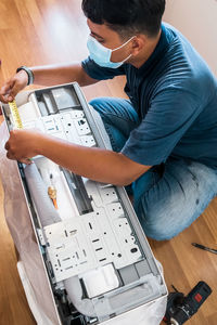 Side view of man working at table