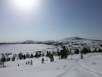 Scenic view of snowcapped mountains against clear sky