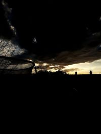 Silhouette landscape against sky during sunset