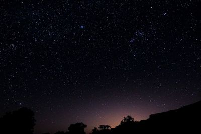 Low angle view of stars against sky at night