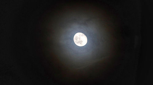 Low angle view of moon against sky at night