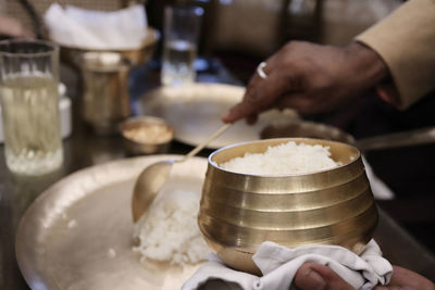 Midsection of person preparing food in kitchen