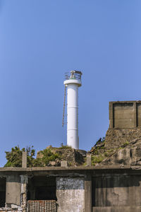 Low angle view of lighthouse against clear sky