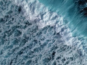 Directly above shot of waves in sea