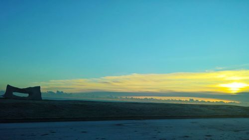 Scenic view of sea against sky at sunset