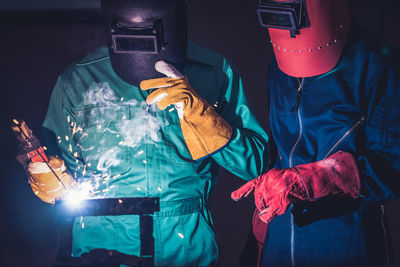 People working in illuminated room