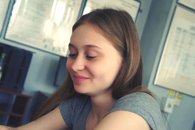 Portrait of a smiling young woman at home