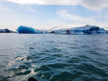 Scenic view of frozen sea against sky