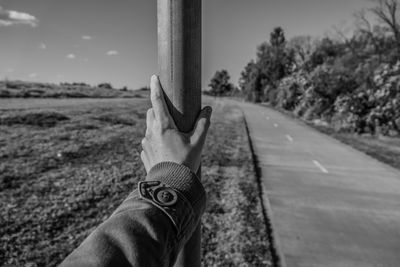 Low section of man against sky