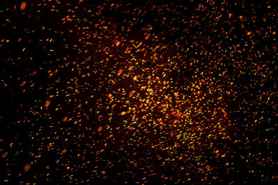 Defocused image of illuminated lights at night
