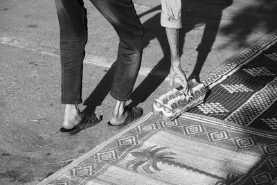 Low section of people standing on street