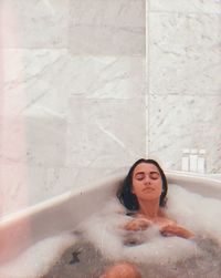 Full length of woman in bathtub