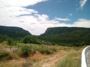 Scenic view of landscape and mountains against sky