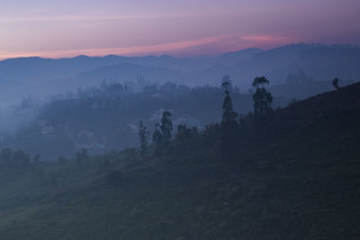 Scenic view of mountains against sky during sunset