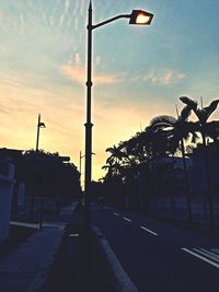 Street light against sky at dusk