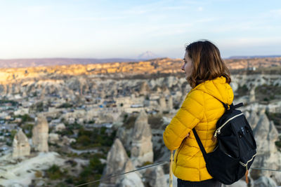 Woman is soaking in sunset in goreme turkey