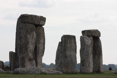 View of rocks on land against sky