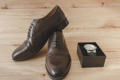 High angle view of shoes on hardwood floor