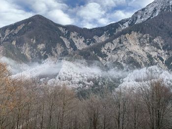 Scenic view of waterfall against sky